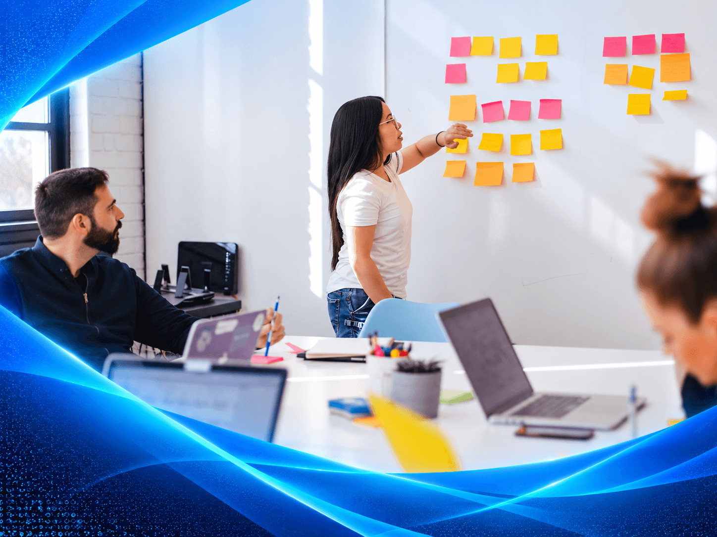 A FORTE team planning work together around a whiteboard